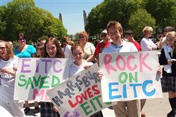Signs made by students display messages of support for the EITC program at the 2007 Party
